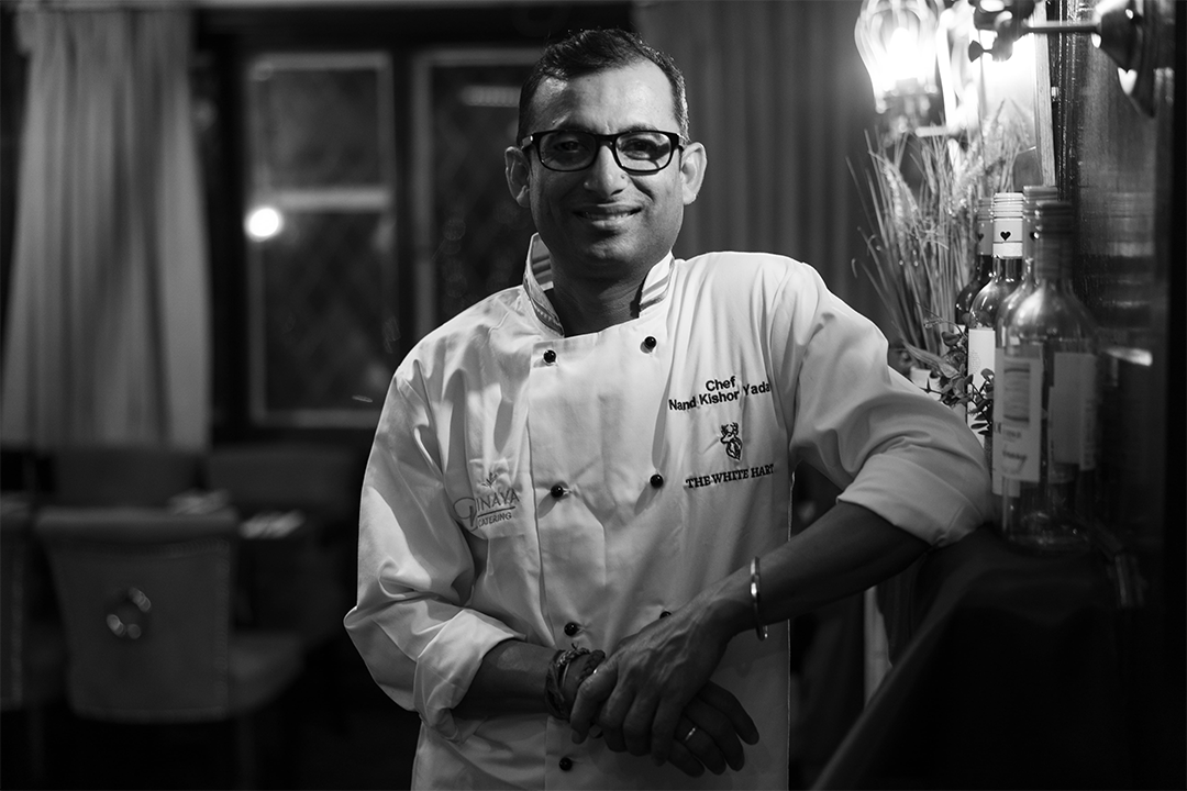 Chef Nand cooking in his restaurant kitchen