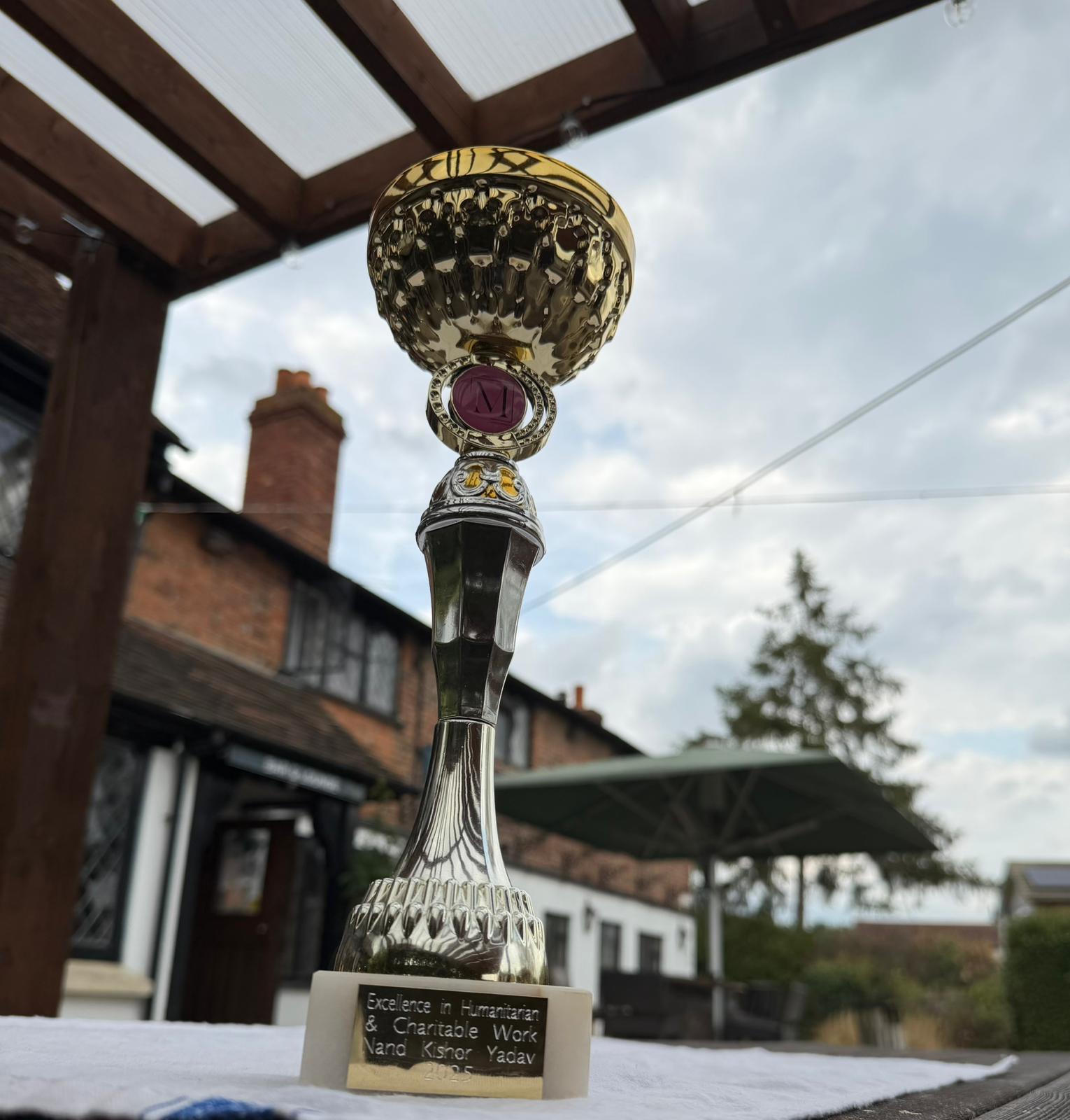 Excellence in Humanitarian and Charitable Work trophy awarded to Nand Kishor Yadav