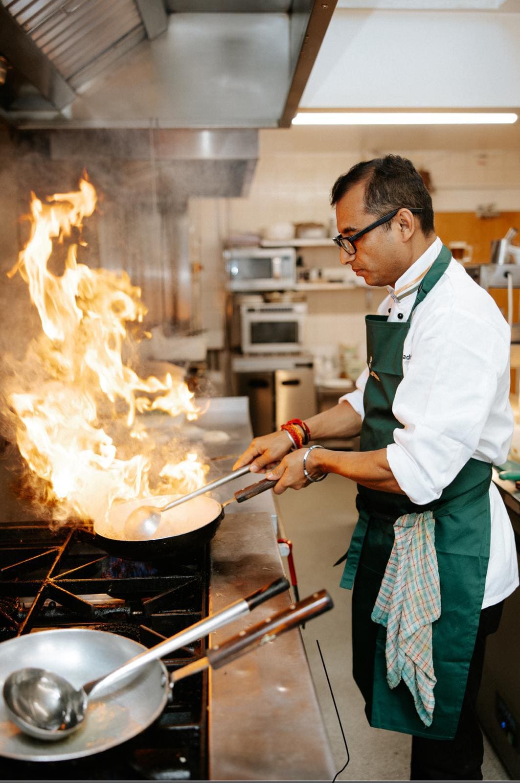 Chef Nand plating a fine dining dish